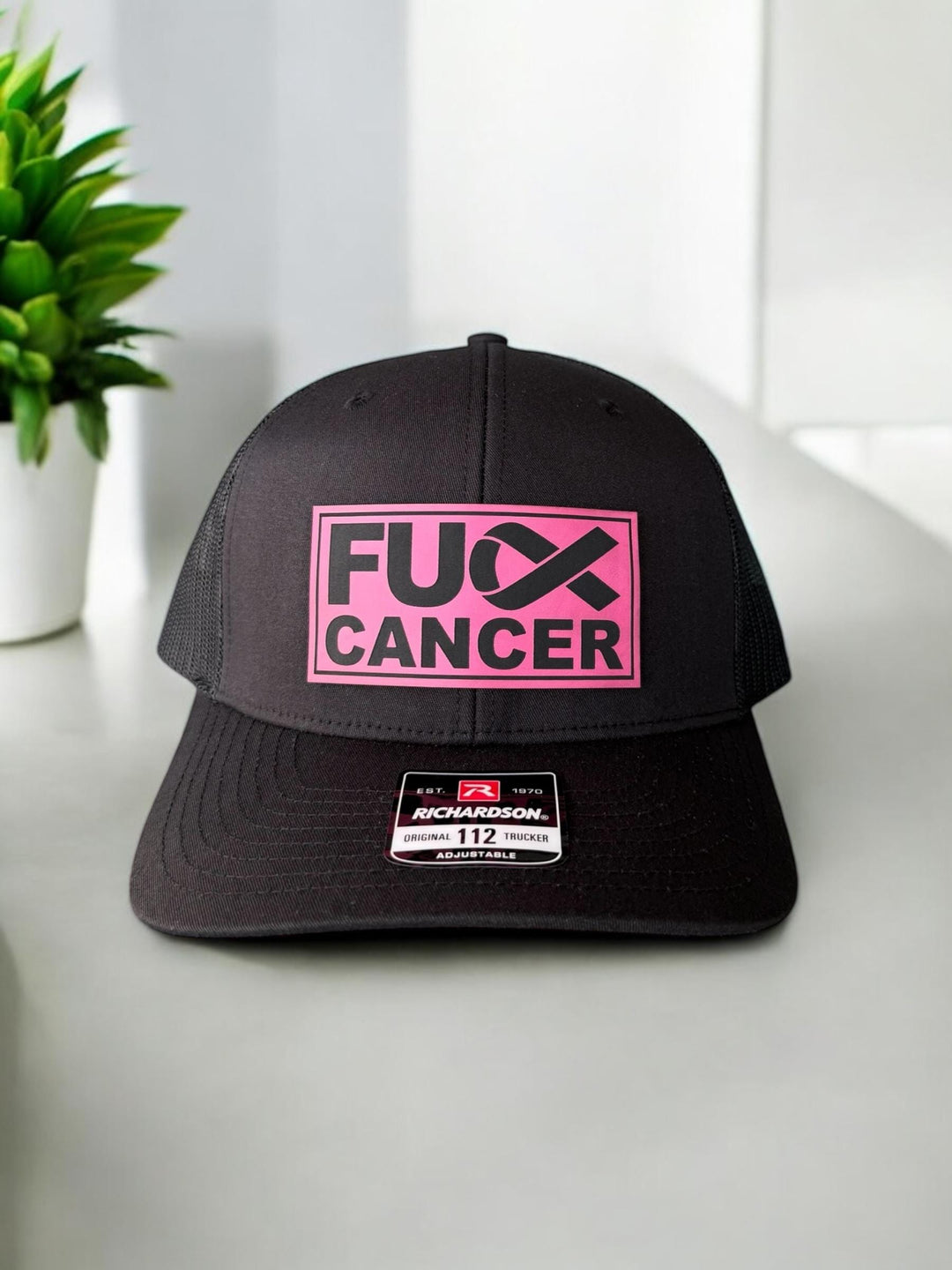 Breast cancer awareness pink ribbon Richardson 112 trucker hat by BubbleHead Ink