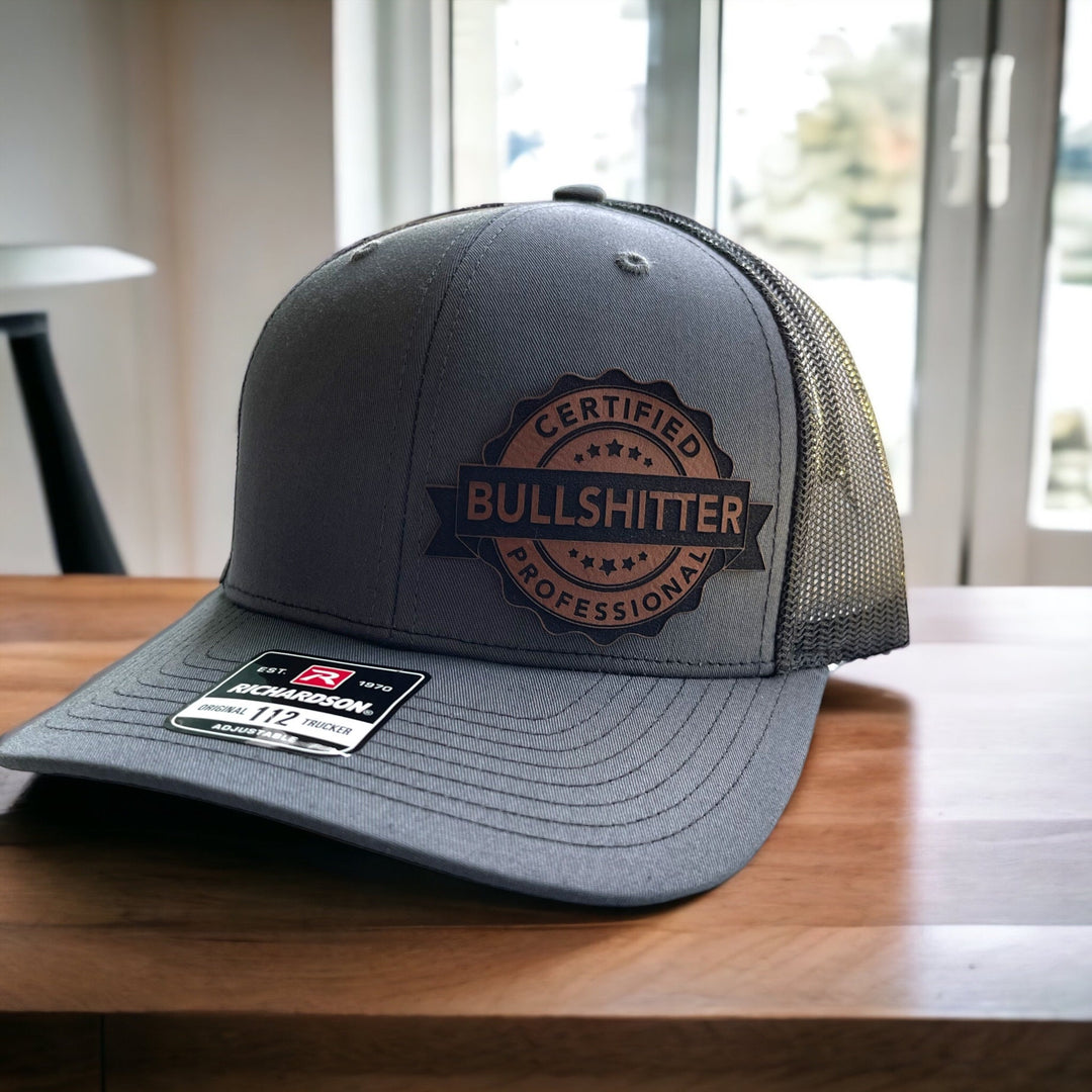 Certified Professional Bullshitter funny trucker hat with leather patch by BubbleHead Ink