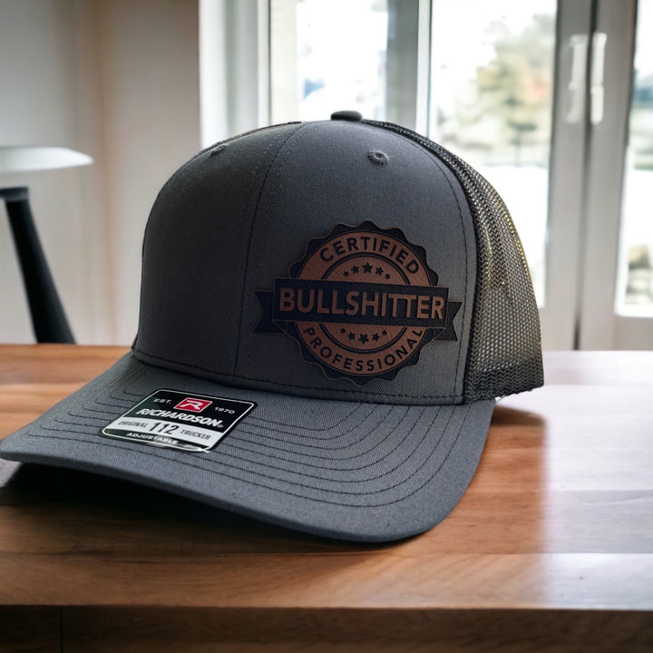 Certified Professional Bullshitter funny trucker hat with leather patch by BubbleHead Ink