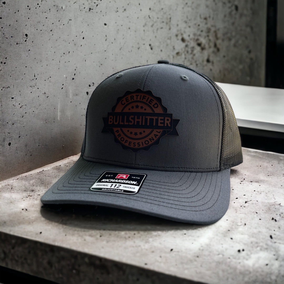 Certified Professional Bullshitter funny trucker hat with leather patch by BubbleHead Ink