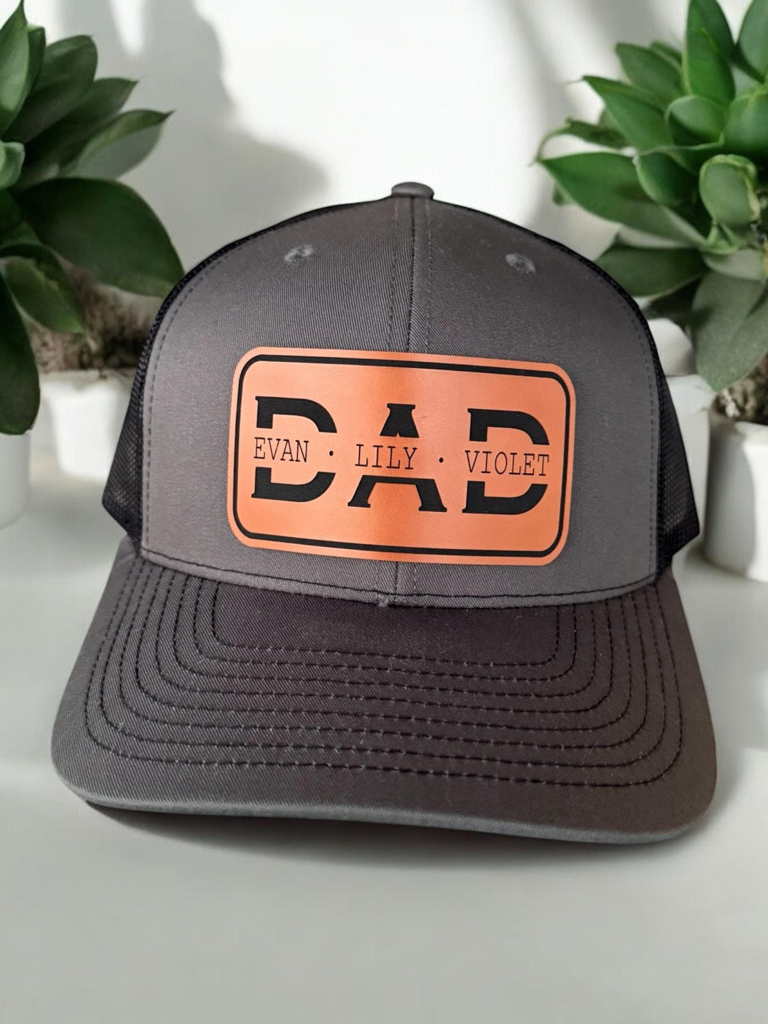 Personalized dad trucker hat with kids' names by BubbleHead Ink