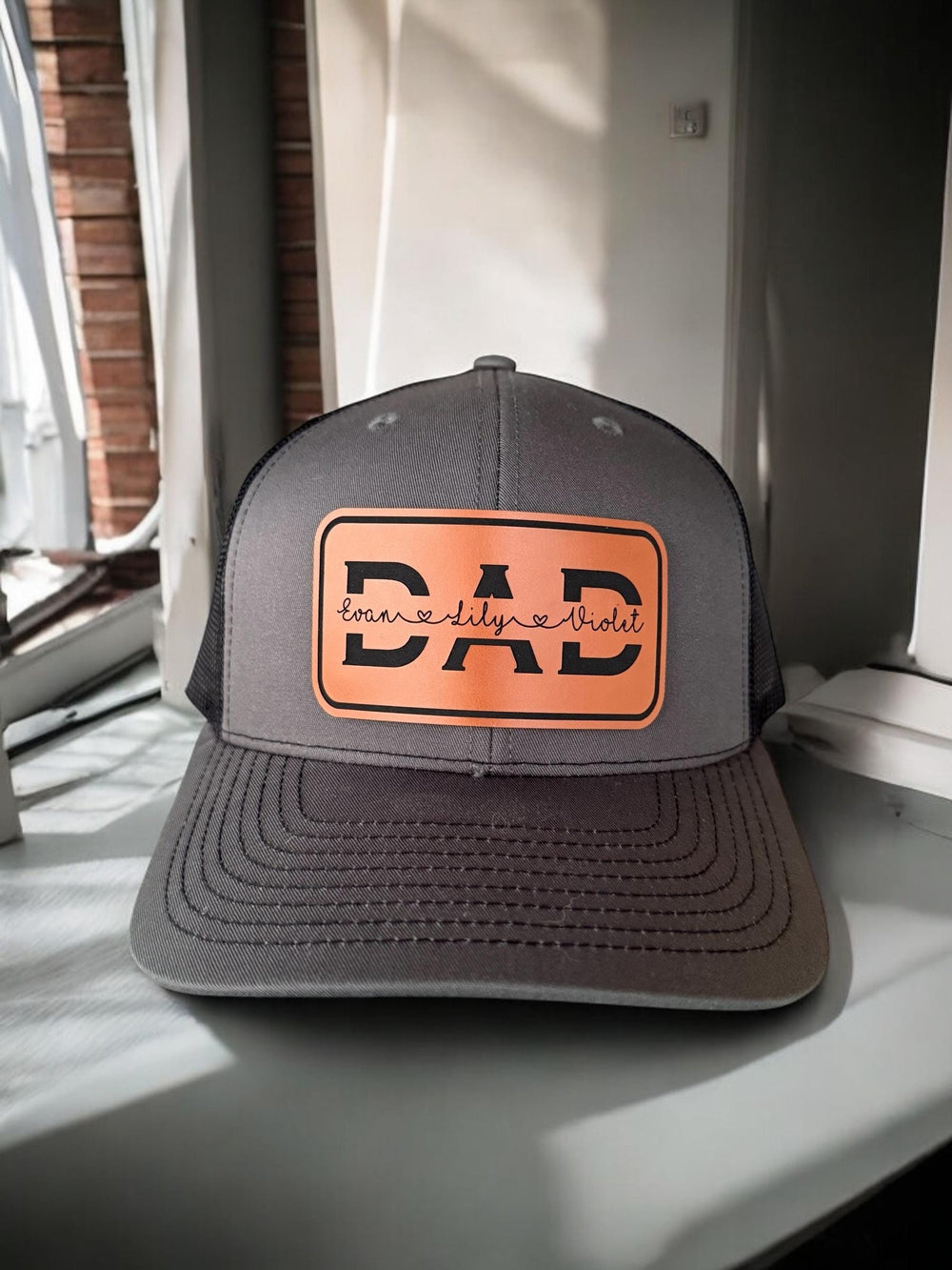 Personalized dad trucker hat with kids' names by BubbleHead Ink
