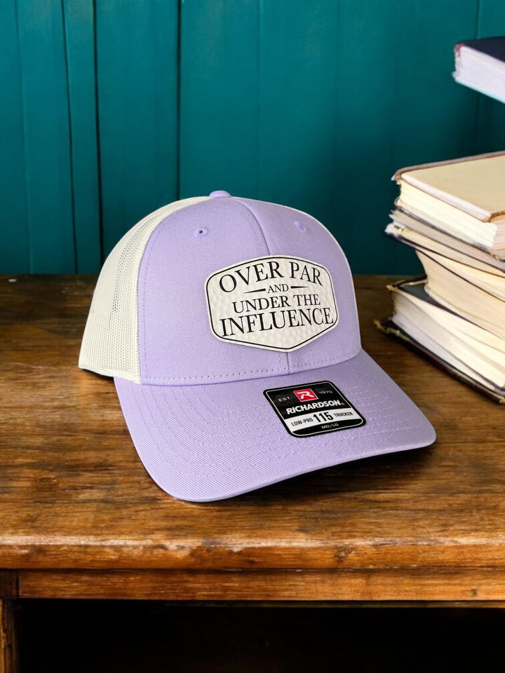 Over Par and Under the Influence girls golf trip trucker hat by BubbleHead Ink
