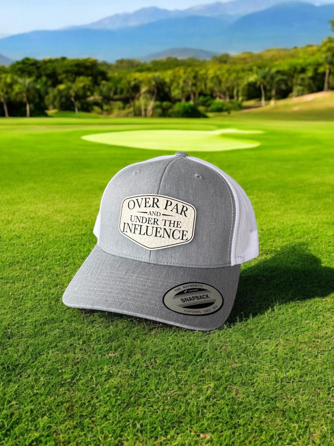 Over Par and Under the Influence girls golf trip trucker hat by BubbleHead Ink