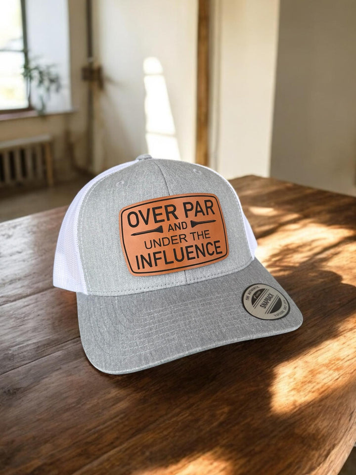 Over Par and Under the Influence funny golf trucker hat by BubbleHead Ink