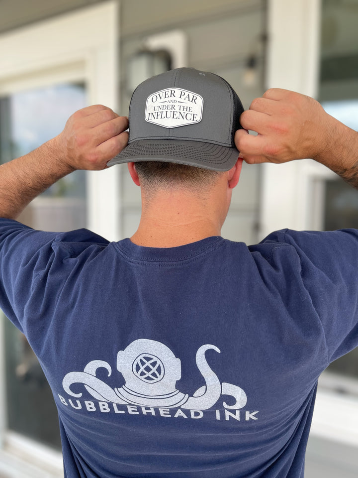 Over Par and Under the Influence funny golf Richardson 112 trucker hat by BubbleHead Ink