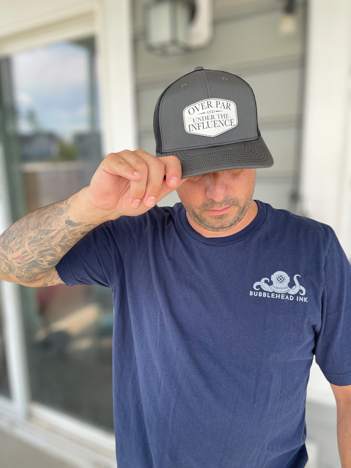 Over Par and Under the Influence funny golf Richardson 112 trucker hat by BubbleHead Ink