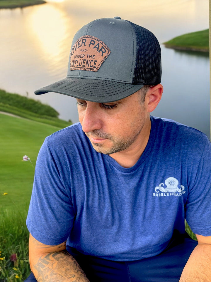 Over Par and Under the Influence funny golf trucker hat by BubbleHead Ink