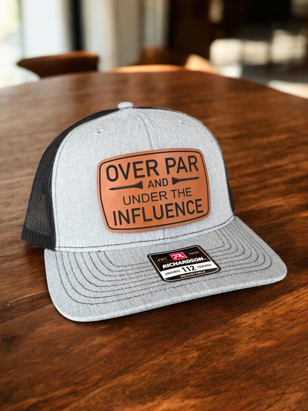 Over Par and Under the Influence funny golf trucker hat by BubbleHead Ink
