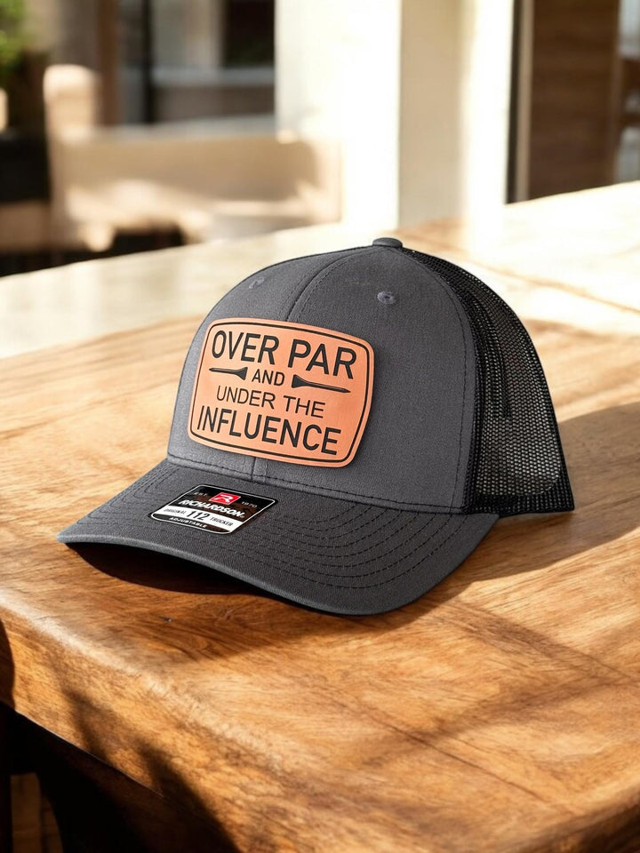 Over Par and Under the Influence funny golf trucker hat by BubbleHead Ink