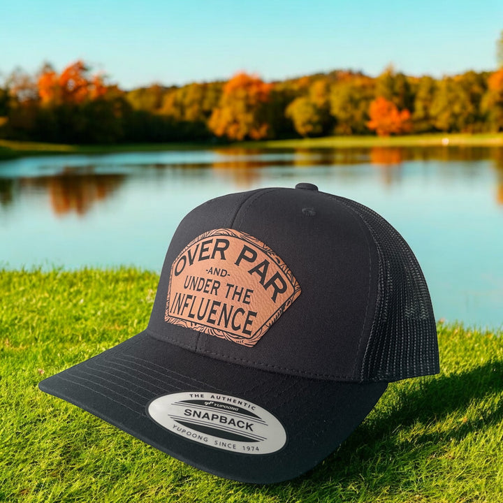 Over Par and Under the Influence funny golf trucker hat in black by BubbleHead Ink
