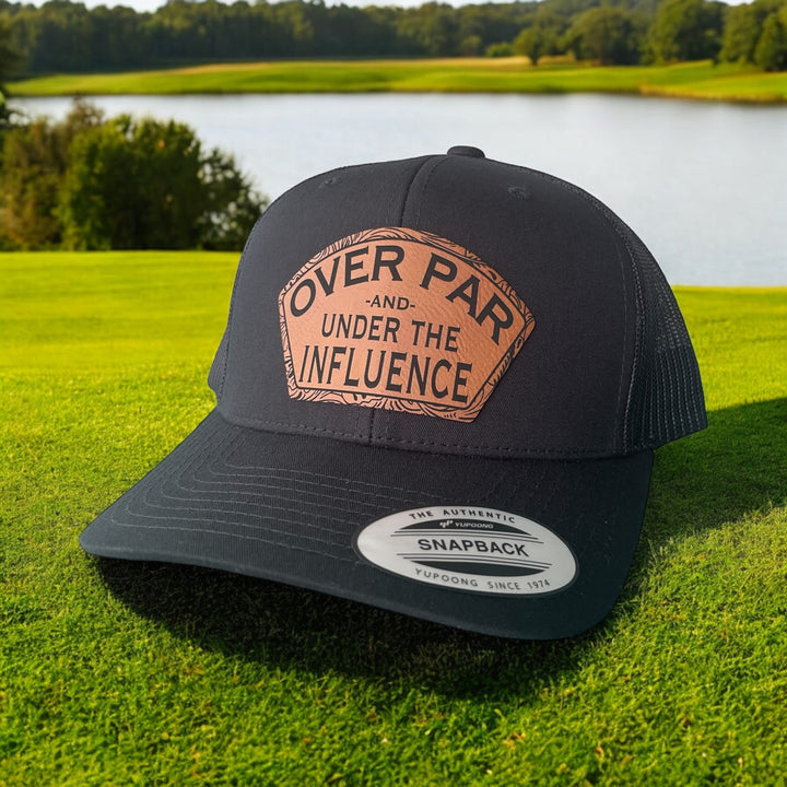 Over Par and Under the Influence funny golf trucker hat in black by BubbleHead Ink
