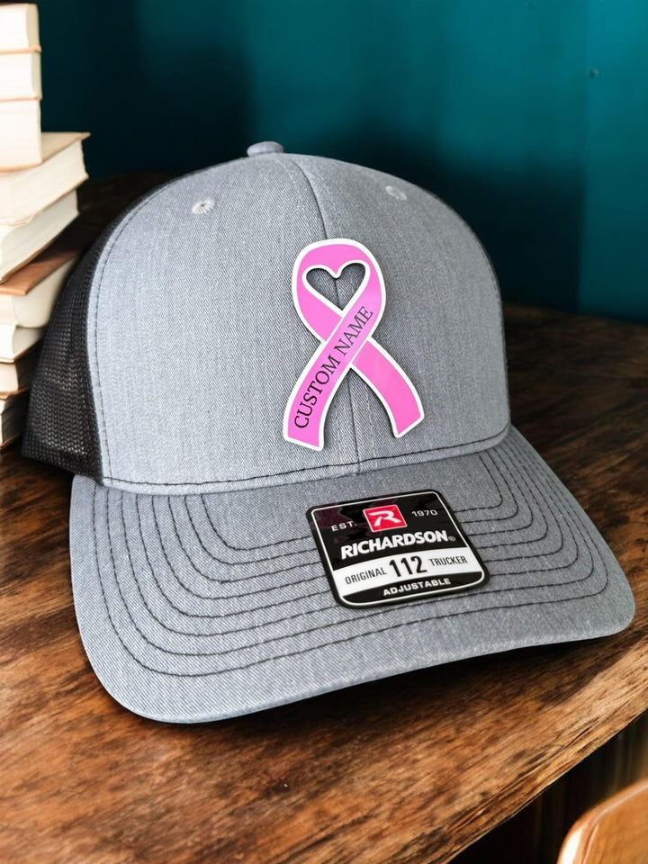 Personalized breast cancer pink ribbon support squad trucker hat by BubbleHead Ink