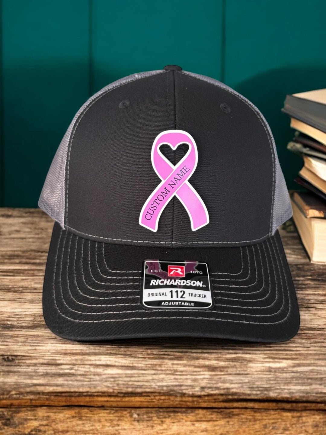 Personalized breast cancer pink ribbon support squad trucker hat by BubbleHead Ink