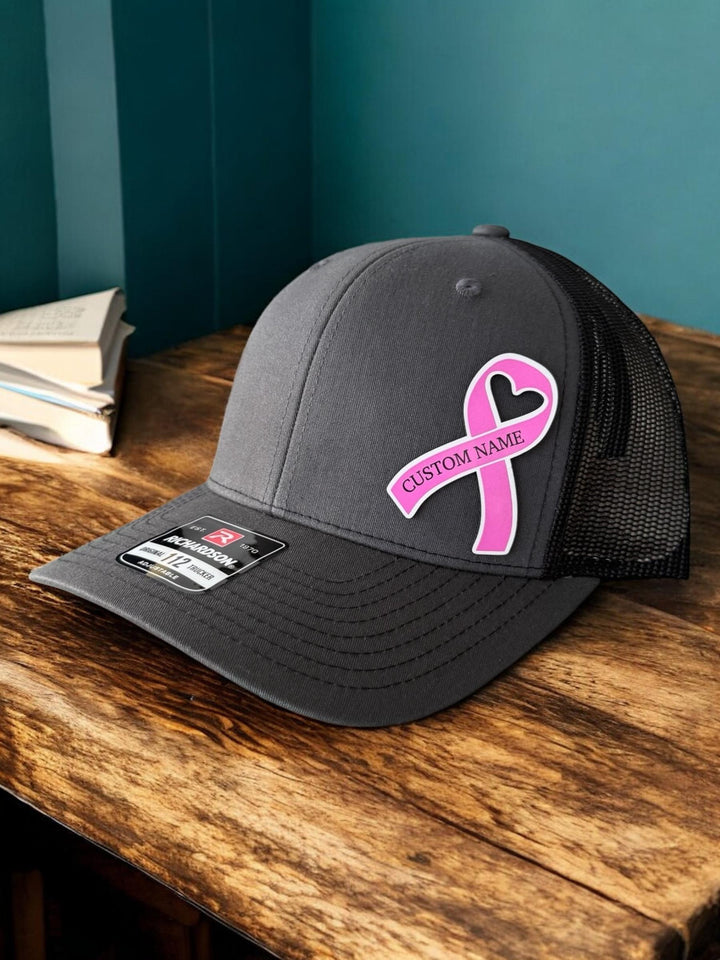 Personalized breast cancer pink ribbon support squad trucker hat by BubbleHead Ink