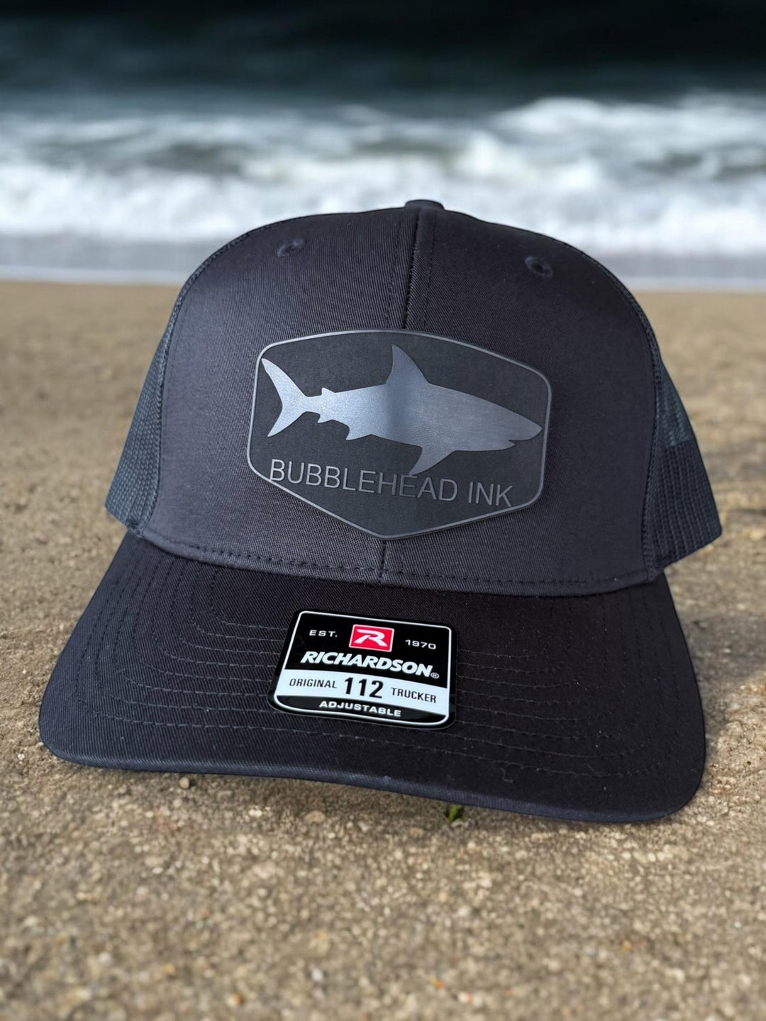 Shark silhouette BubbleHead Ink patch Richardson 112 trucker hat