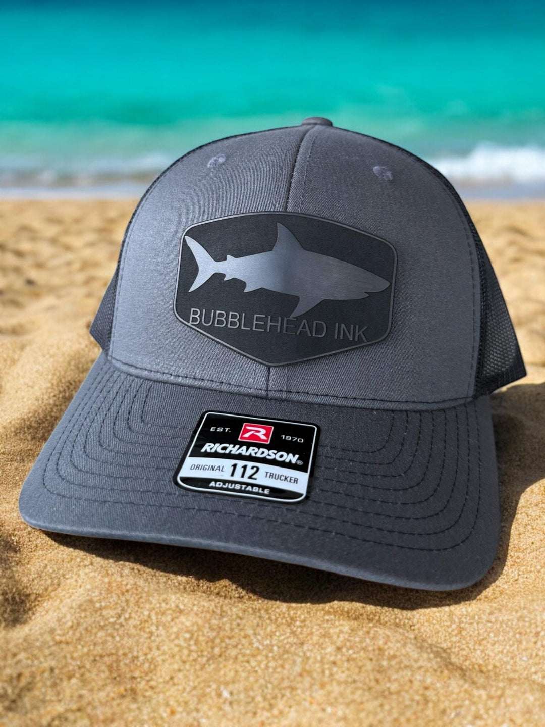 Shark silhouette BubbleHead Ink patch Richardson 112 trucker hat
