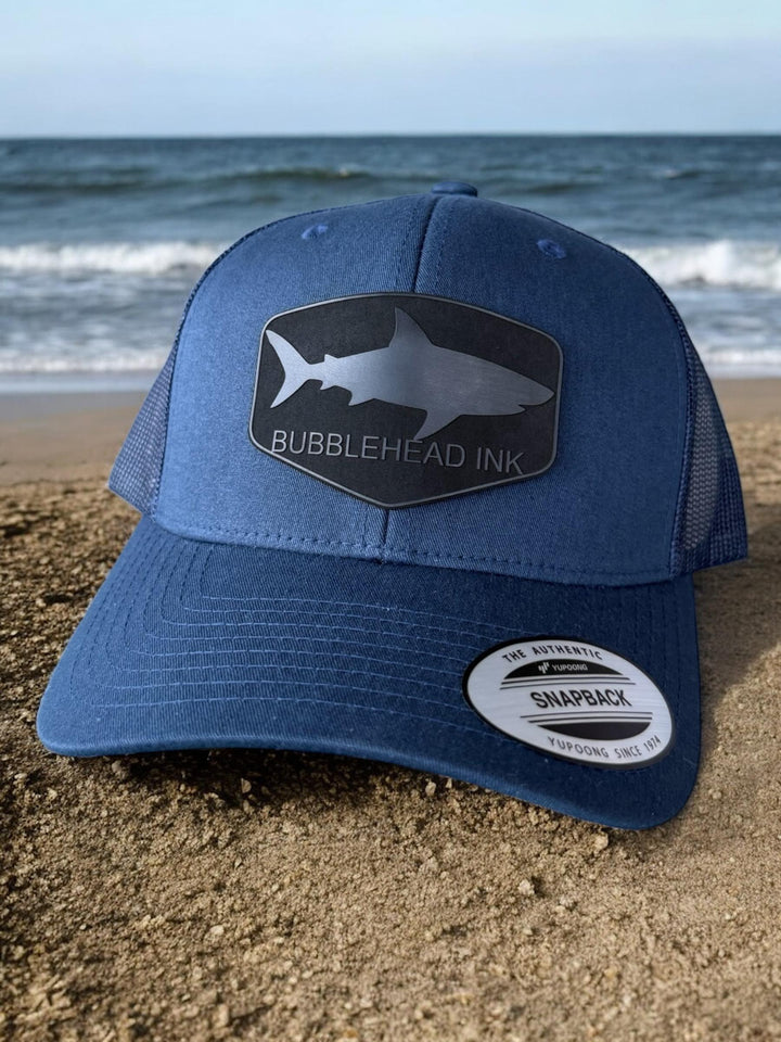 Shark silhouette BubbleHead Ink patch Richardson 112 trucker hat