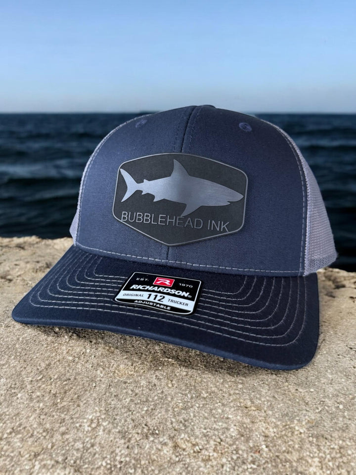 Shark silhouette BubbleHead Ink patch Richardson 112 trucker hat