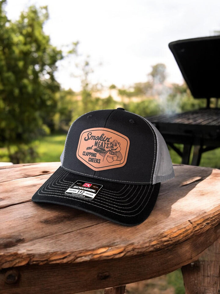 Smokin Meats and Clapping Cheeks funny BBQ trucker hat by BubbleHead Ink