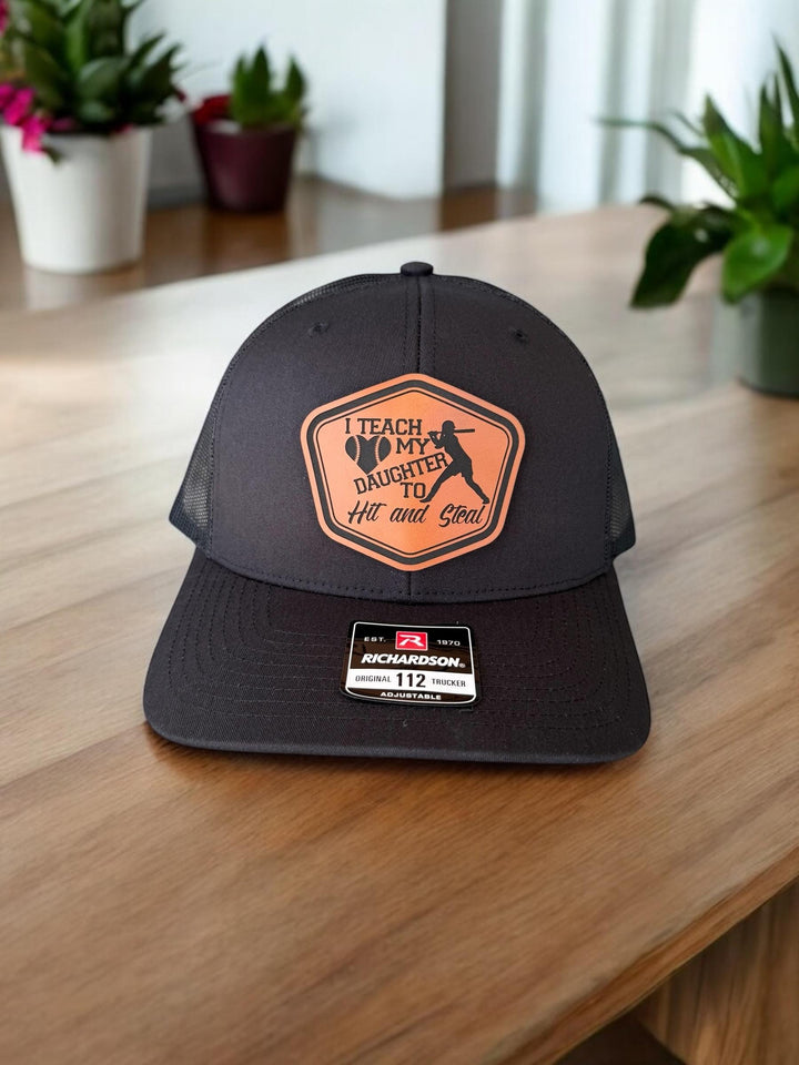 I Teach My Daughter How To Hit and Steal funny softball dad hat by BubbleHead Ink