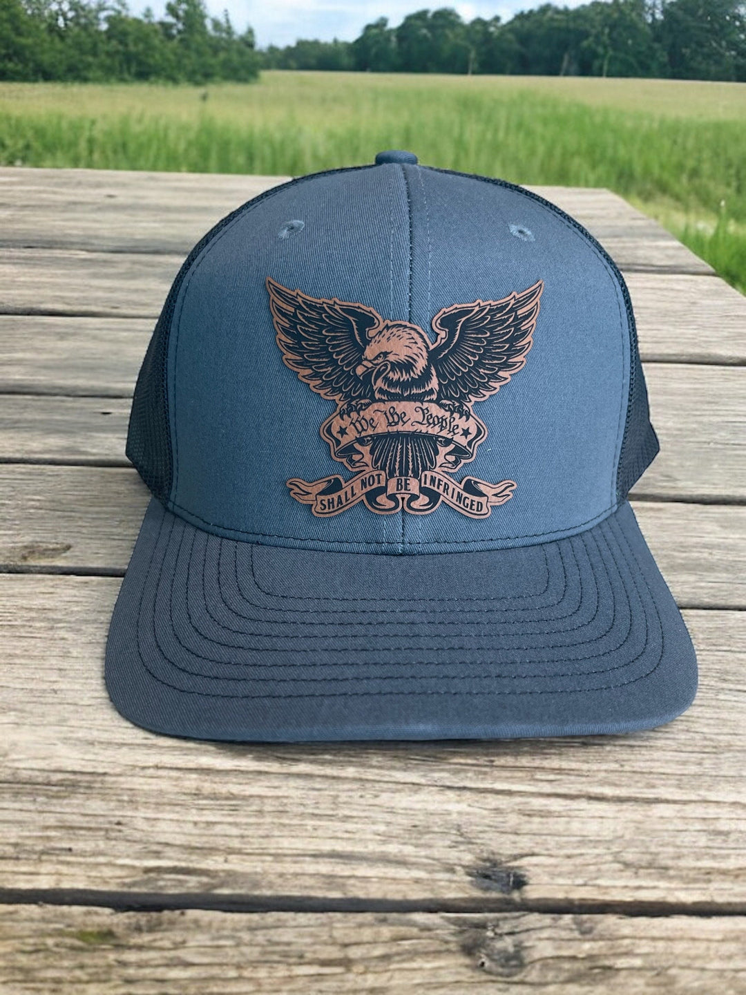 We The People eagle patriotic trucker hat by BubbleHead Ink