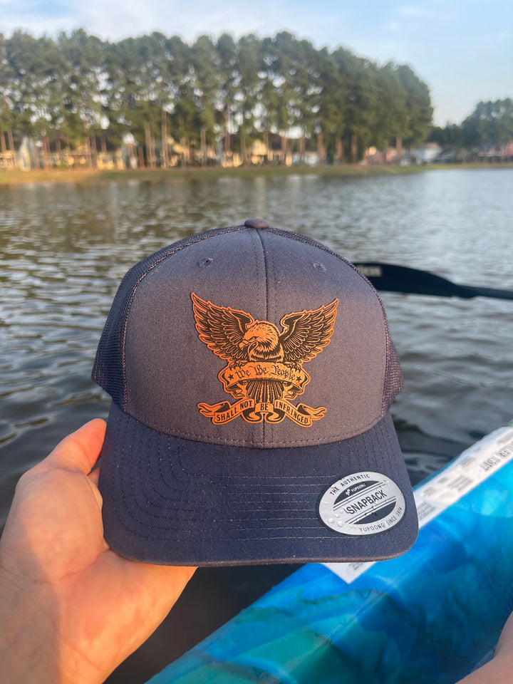 We The People eagle trucker hat in navy by BubbleHead Ink